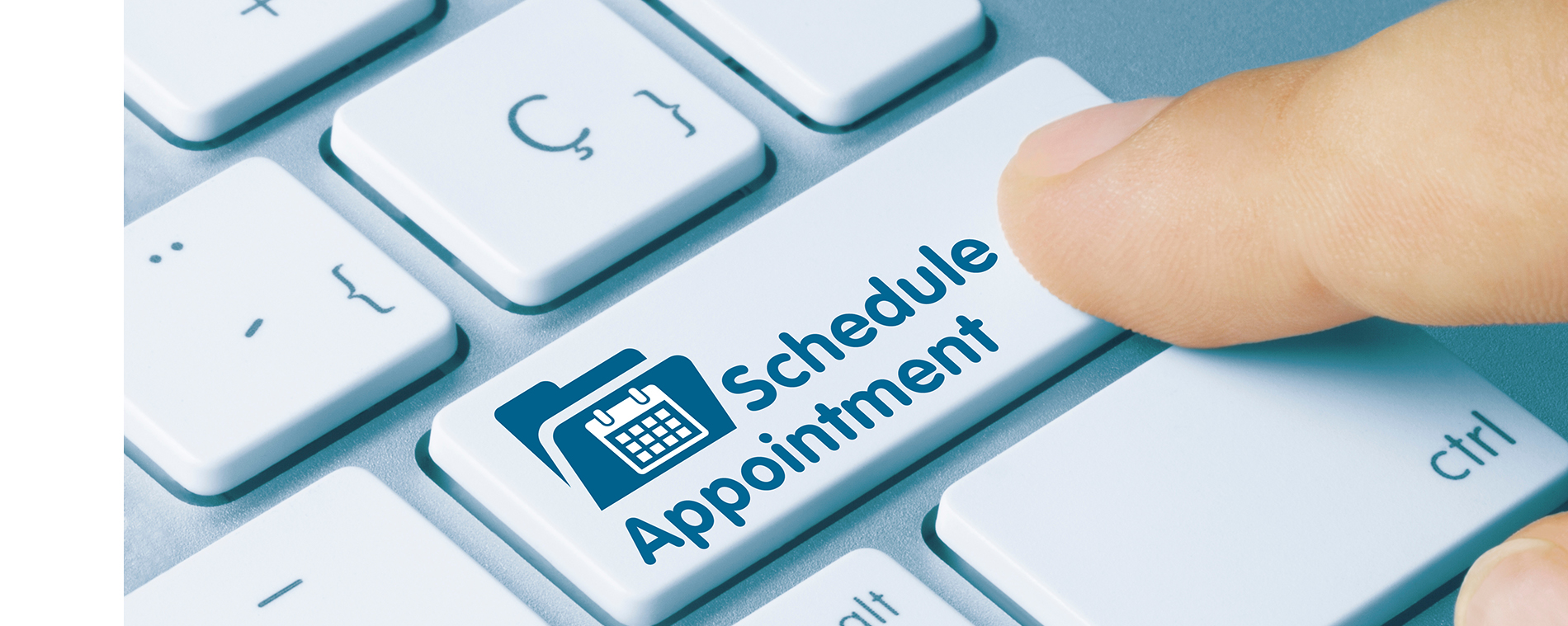 The image shows a close-up of a person s hand pressing the  schedule  button on a computer keyboard, with a focus on accessibility and the text  appointment schedule  displayed on the screen.